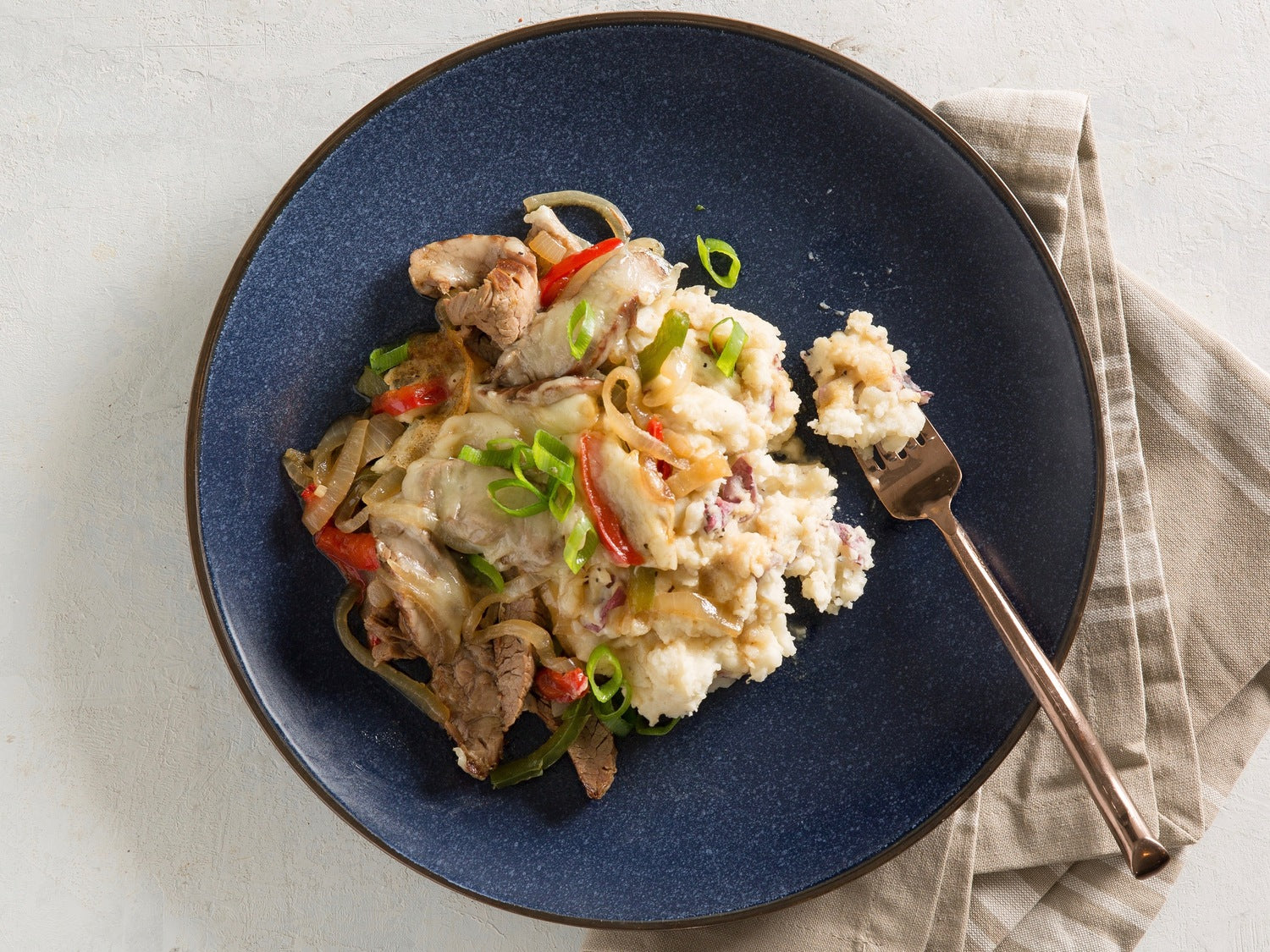 Philly-Style Cheesesteak with Garlic Mashed Potatoes 